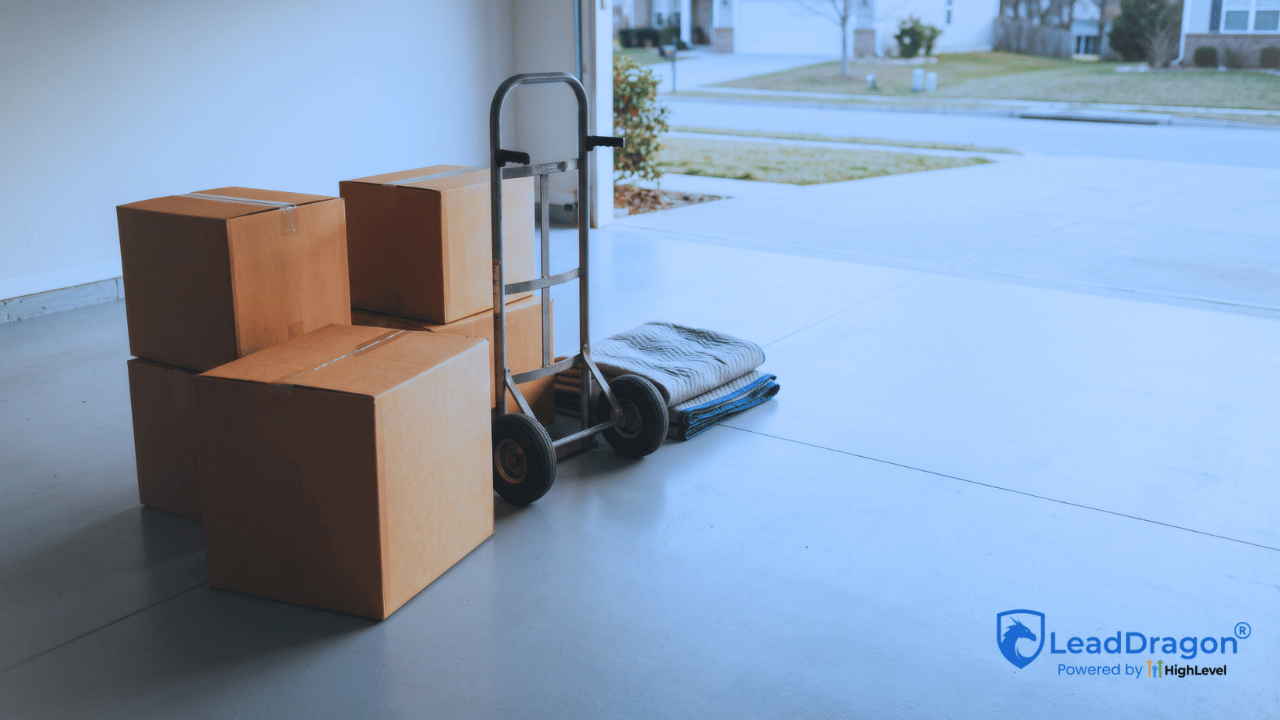 Nearly empty residential garage with moving boxes during a household property transition.